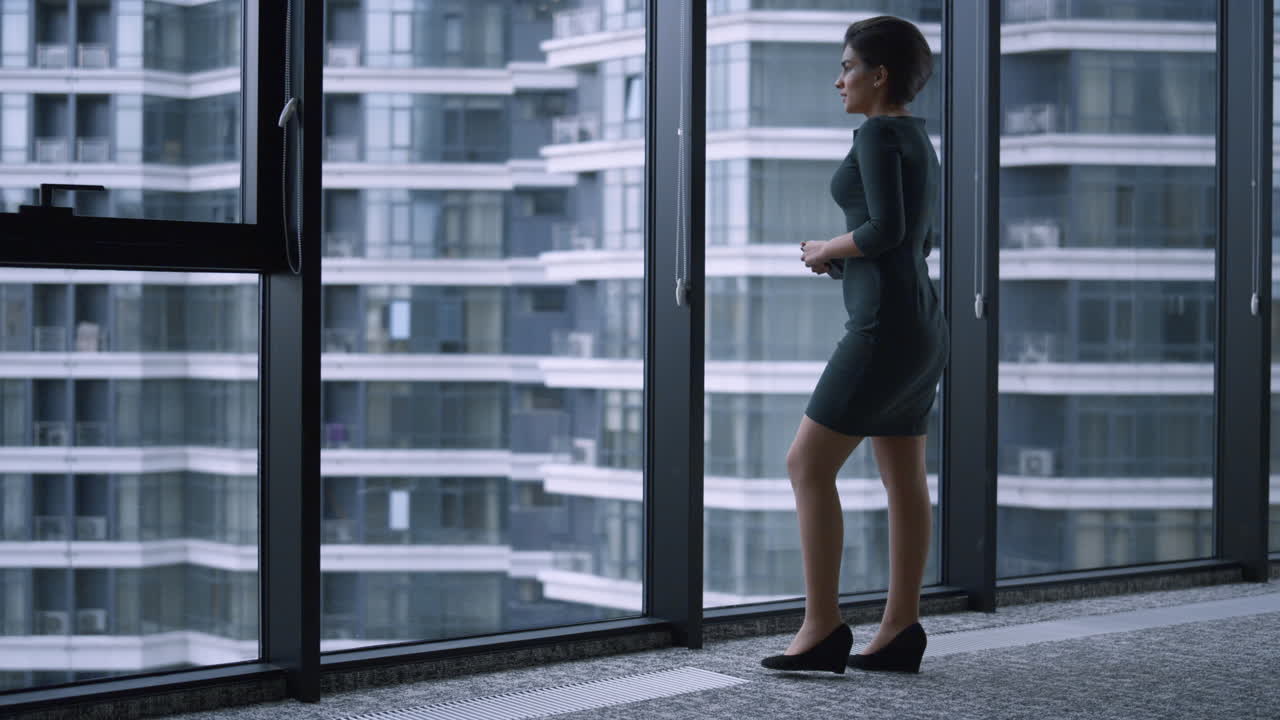 Executive woman texting on mobile phone