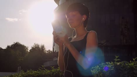 lady messaging on smart phone on the street.