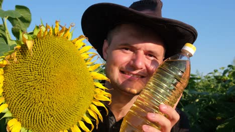 A Farmer Advertises Sunflower Oil he is in the Middle of a Sunflower Plantation a Farmer Advertises Sunflower Oil he is in the Middle of a Sunflower Plantation Agriculture