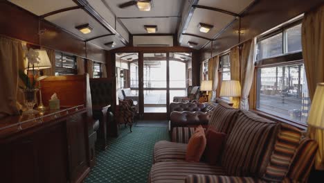 amidst the rhythmic clatter of rails, an observation car on a luxury train reveals panoramic splendors