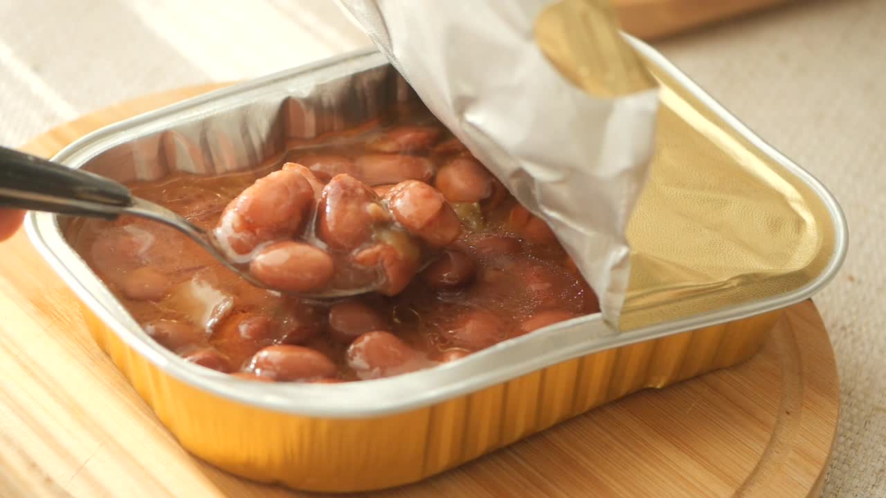 Canned beans on a wooden surface
