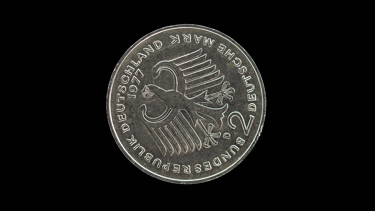 Germany 1977 two deutsche mark coin reverse with federal eagle and denomination rotating on black background