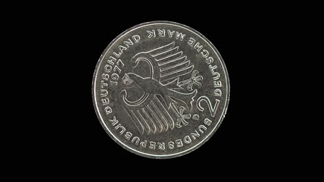 germany 1977 two deutsche mark coin reverse with federal eagle and denomination rotating on black background