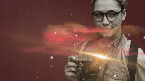 woman holding digital camera against space in background