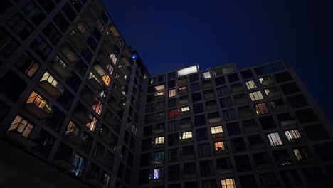 modern evening apartment with illuminated windows pov walk to overlay