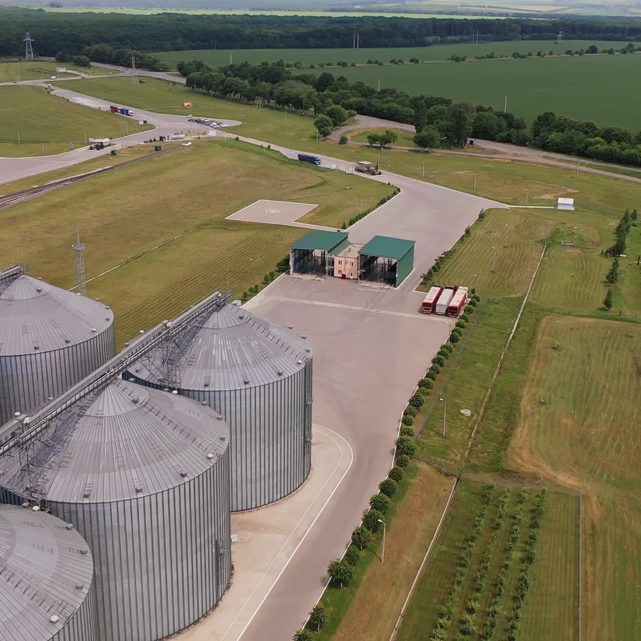 Aerial view of grain elevators in a rural landscape