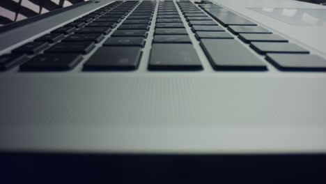 Grey-laptop-computer-with-black-keyboard.-Modern-black-keyboard-of-laptop