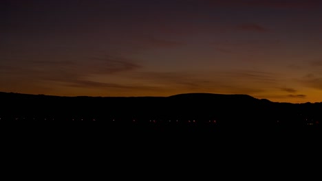 Sunset-over-a-quiet-village,-meadows-at-sundown,-light-change,-time-lapse