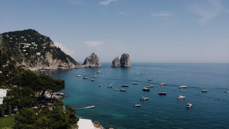 aerial view leaving italy's coast to reveal boats safely sheltered in the harbor