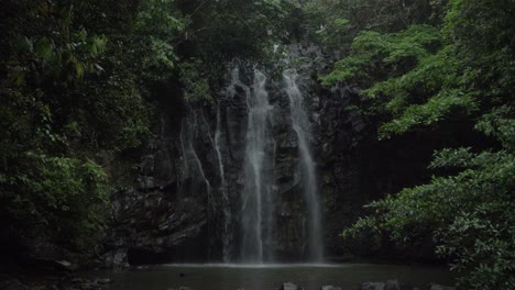 ellinjaa falls water flowing down on vertical cliff in qld, australia