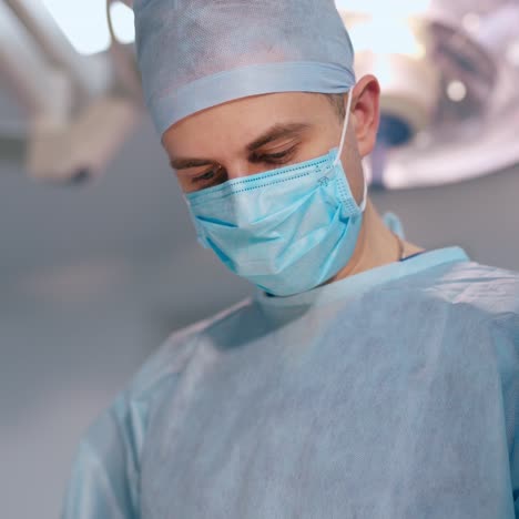 doctor man and a nurse in medical masks. professional surgeon performing an operation in the hospital. healthcare concept.