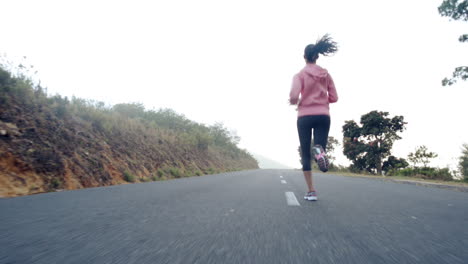 woman-running-on-road-close-up-shoes-steadicam-shot