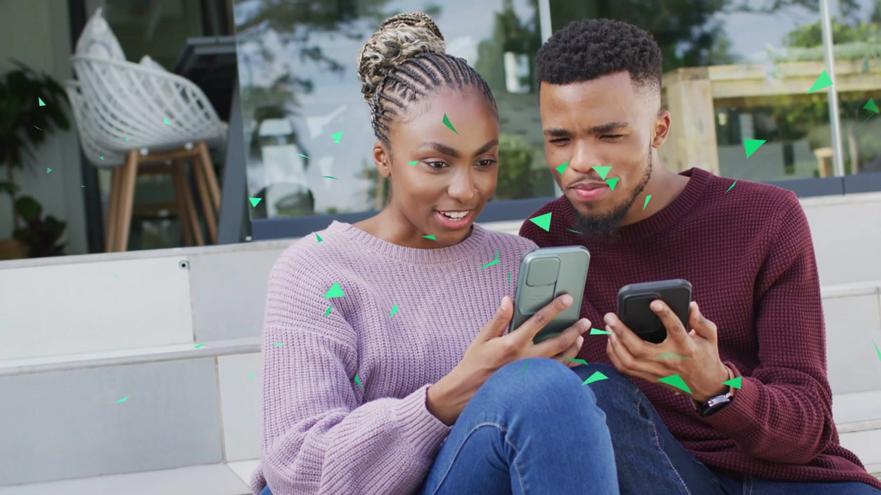 Woman tilting phone and sharing feed on steps man leaning in reacting, green triangles showing tech