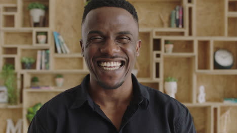 close-up-portrait-of-charming-young-masculine-african-american-man-laughing-excited-enjoying-successful-lifestyle