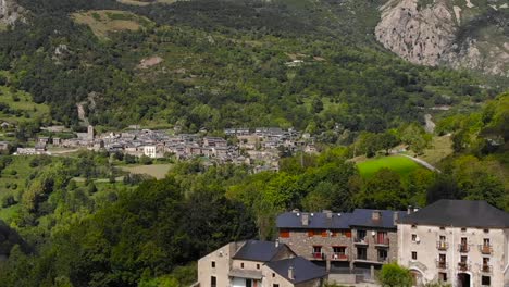 aerial: small town in the mountains in spring