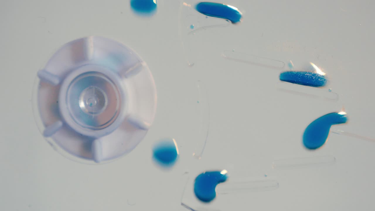 Spinning Cog Wheel with Bouncing Ink Blobs