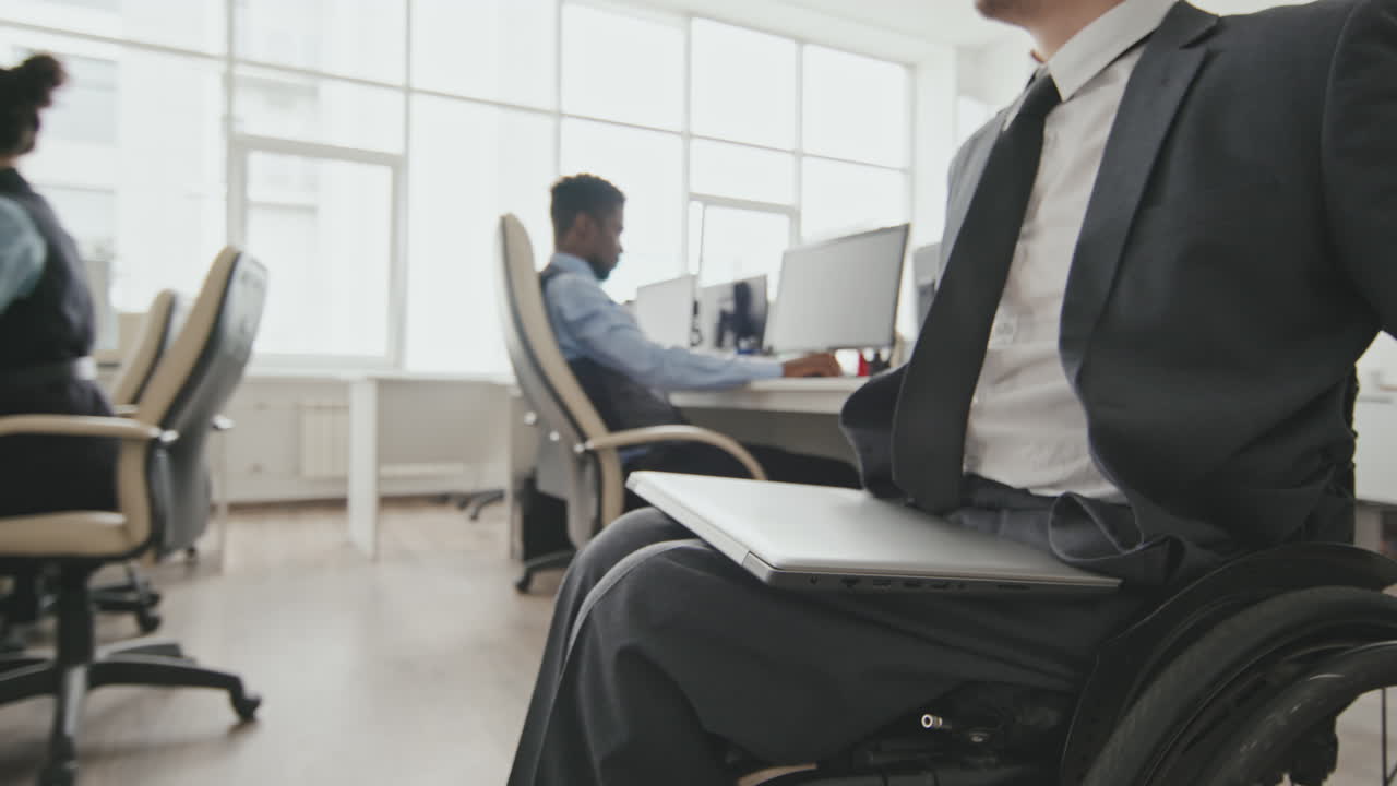 Businessman in Wheelchair in Office