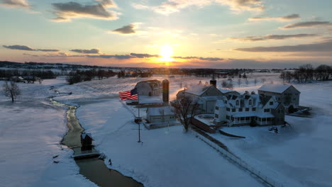 Family-farm-in-winter-snow-at-sunrise