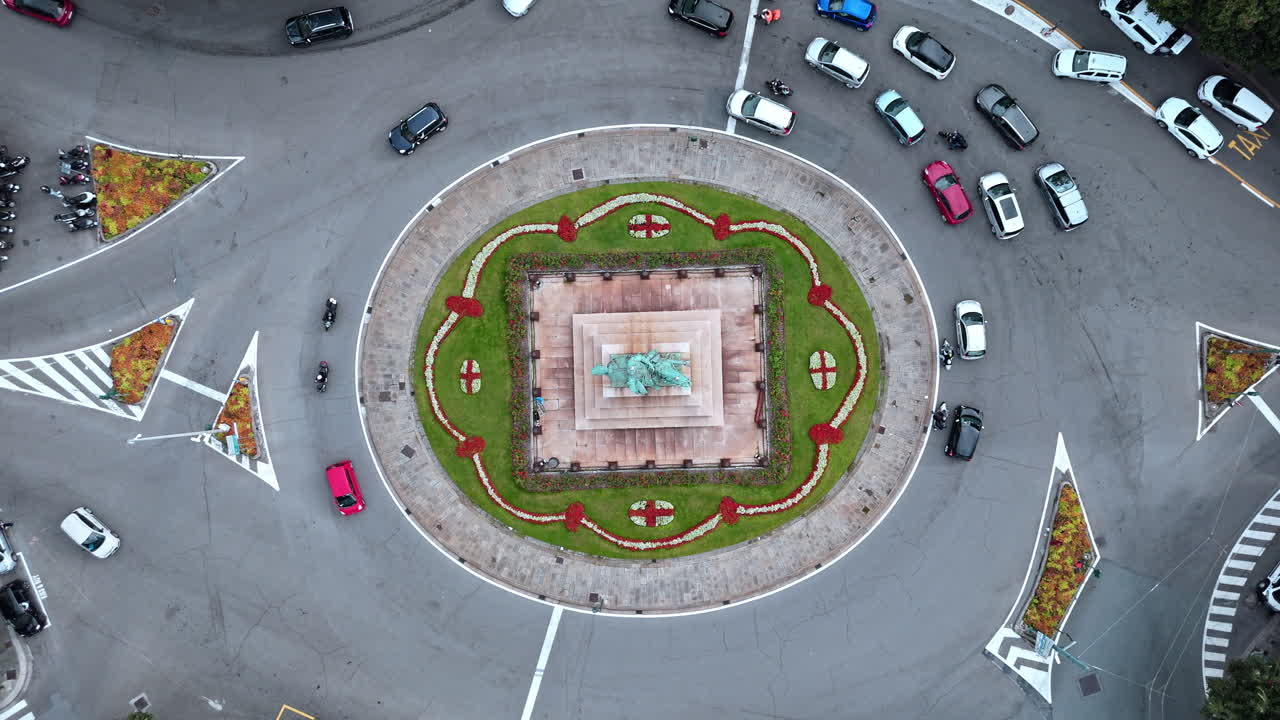 Aerial View of a Roundabout with a Statue in the Center