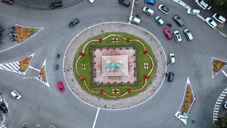 Aerial View of a Roundabout with a Statue in the Center