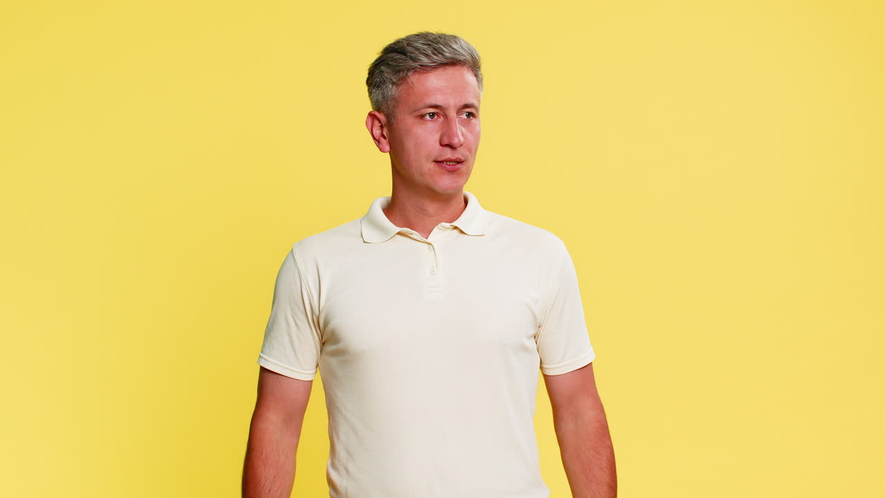 Adult man yelling at smartphone angrily arguing during call pressing end button with hand gestures