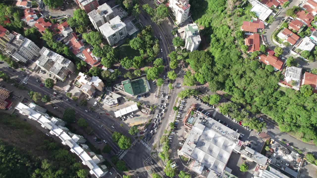 Aerial view tilt up over lush Caurimare urban landscape