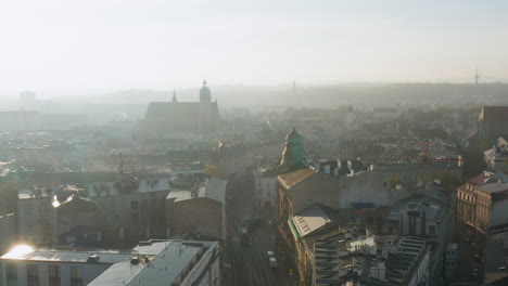 foggy, autumn morning over old town, kazimierz and stradom district in krakow