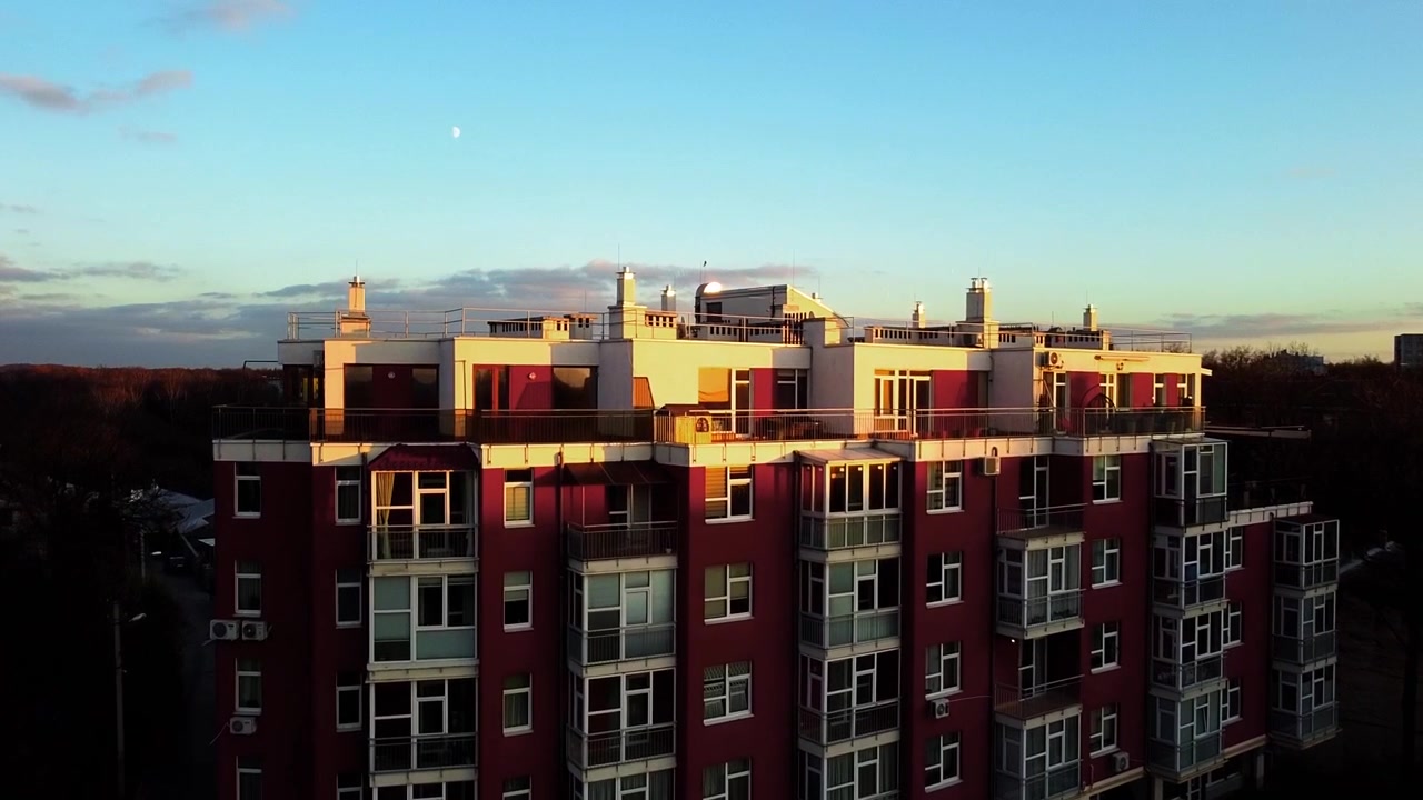 Aerial view of a drone flying over the residential building.
