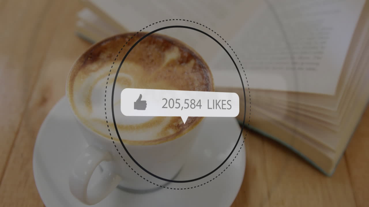 Flat design coffee cup swirling latte art on wooden table receiving likes overlay next to book