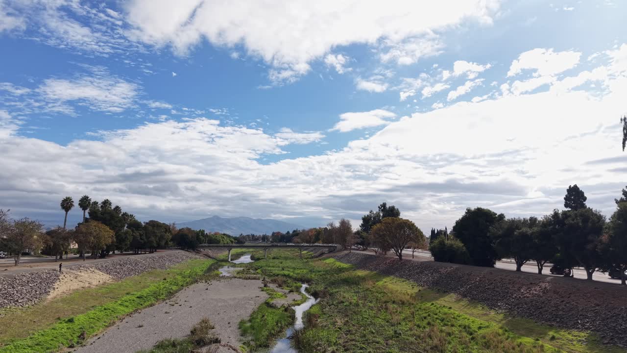 High-angle views spotlight the way Alameda Creek Trail separates neighborhoods with its green passage, blending bike paths, trees, and residential patterns into a balanced visual composition