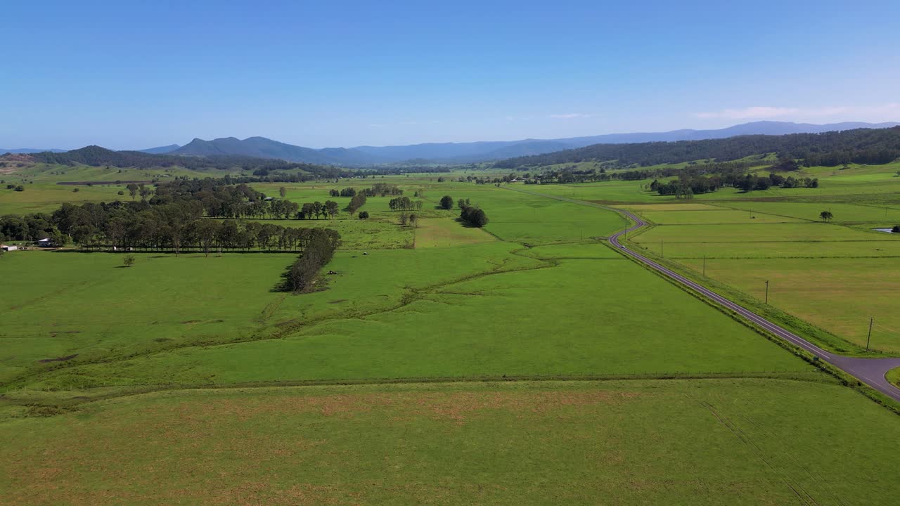 Forward moving aerial footage of farmland surrounding Kyogle in Northern New South Wales, Australia