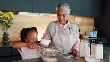 grandmother and granddaughter baking together