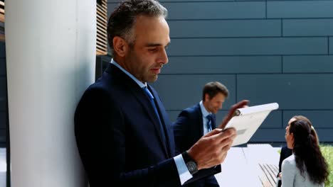 Businessman-using-digital-tablet-in-office