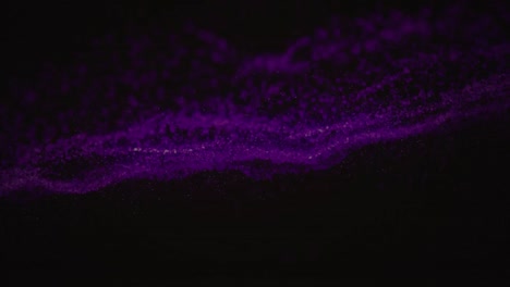 animation of purple wave of spots on black background