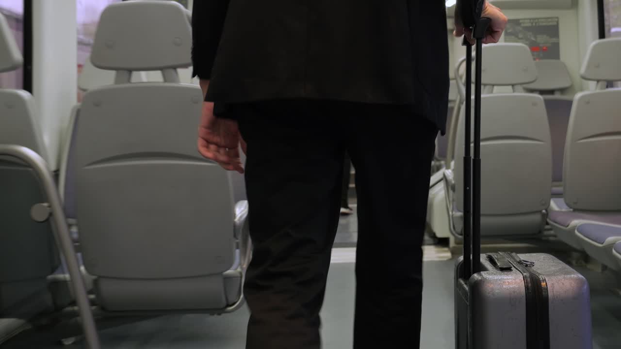 Tourist man with suitcase baggage in spain, A traveler with luggage suit jacket on business street go to a hotel, business office, airport terminal, enjoying the vibrant atmosphere