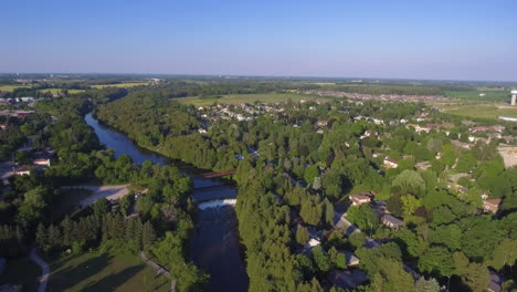 incredible aerial view of a small town with a river in rural ontario