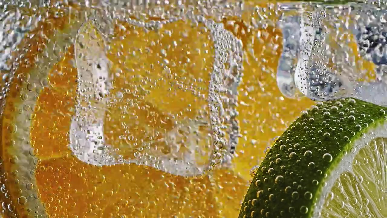 Macro view of citrus slices and bubbles in carbonated water