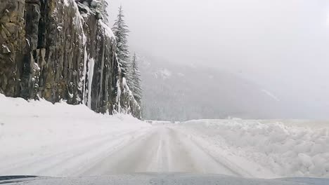 driving offroad on snow-covered landscape in snoqualmie, washington with snowfall during winter