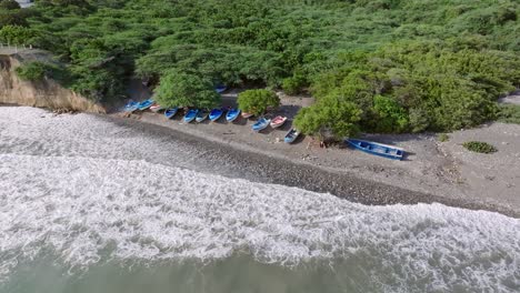 aerial view of matanzas beach with some boats in bani city, peravia province, dominican republic