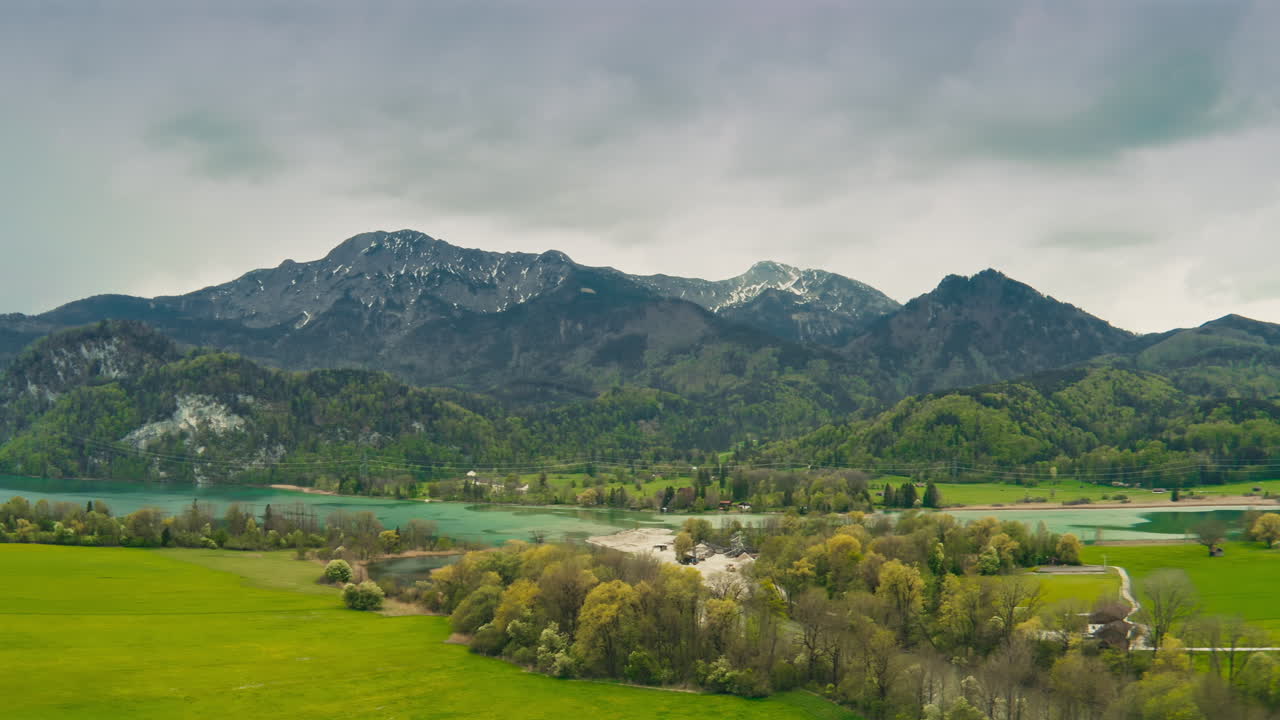 Indulge in the serene and awe-inspiring beauty of Bavaria, Germany with this stunning aerial footage of its towering mountains and picturesque lakes. Ideal for travel and nature projects