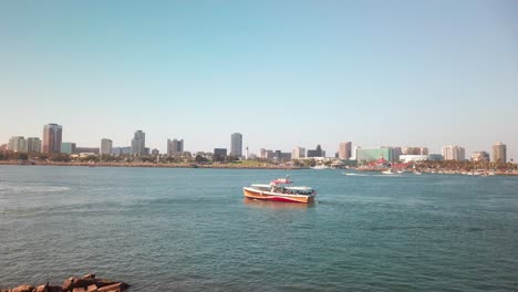 Follow-shot-of-a-marina-tour-boat-entering-port