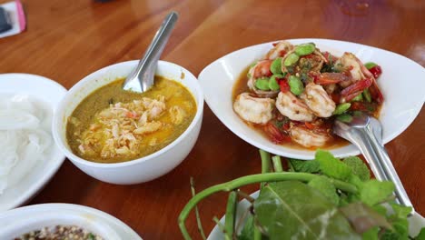 a variety of thai dishes served on a table