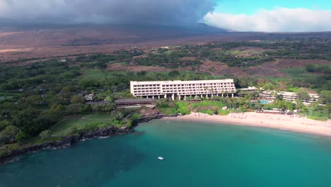 aerial time lapse view reveal mauna kea crescent tropical beach and luxury hawaiian hotel resort