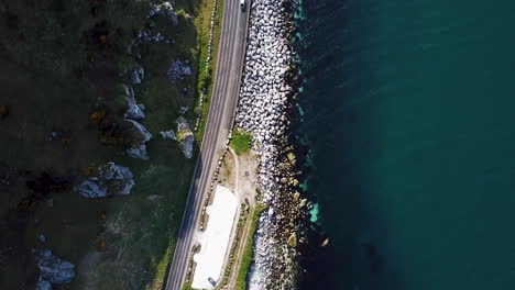 Downward-aerial-view-of-road-on-coastline-in-northern-Ireland