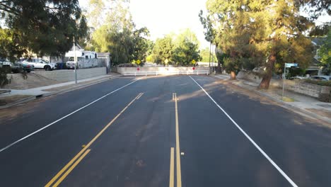 car-driving-down-road-aerial