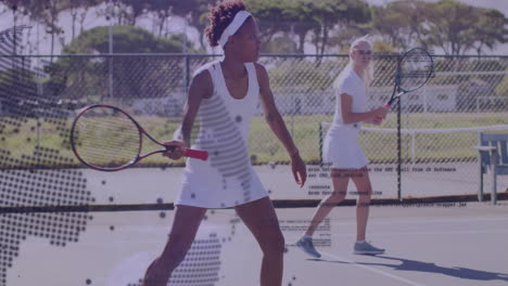 two women playing tennis on outdoor court with digital overlay animation