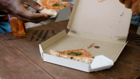 close-up of pizza inside a carton box