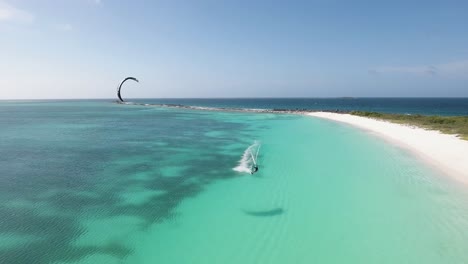 KITER-FLYING-ON-turquoise-WATER-CARIBBEAN-SEA-CRASQUI-ISLAND,-LOS-Roques