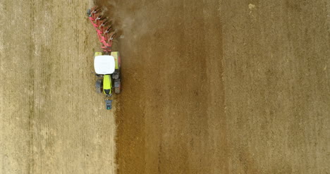 Agriculture-Wide-Shoot-Of-Tractor-Plowing-Field-4K-2