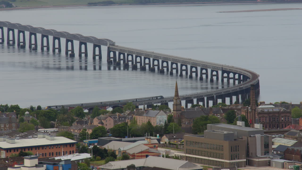 Wide shot of the north part of the Tay rail bridge with train taken from law hill